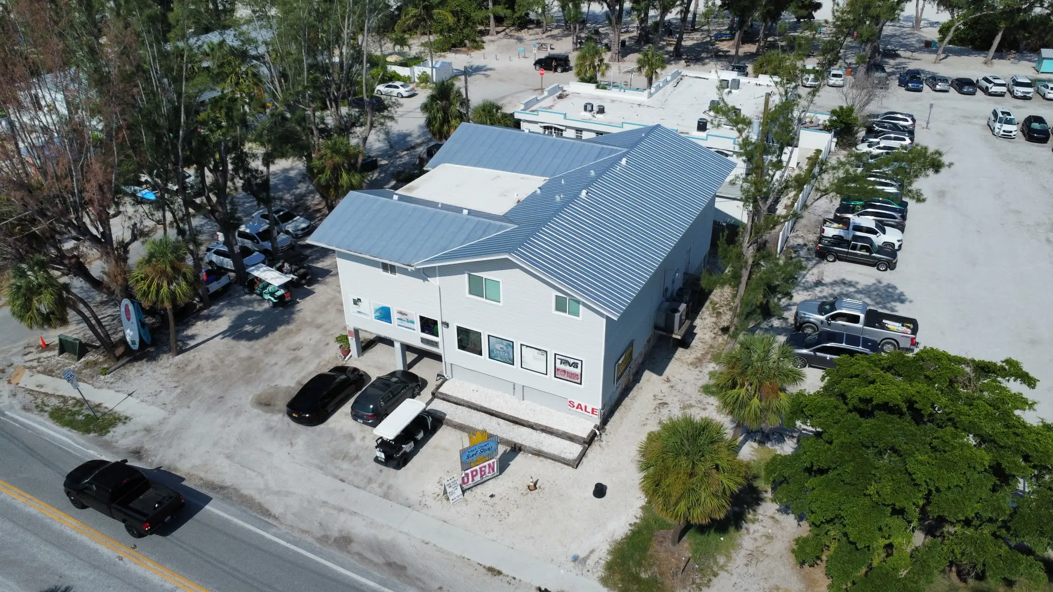 5V Crimp Metal and TPO Roof Replacement at West Coast Surf Shop in Holmes Beach